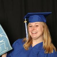 soon to be graduate with foam finger at the photo booth